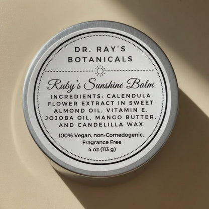 A round white tin of Calpurnia, a traditional Greek and Roman syrup, with a white label featuring black text and a small illustration of a woman holding a pitcher.